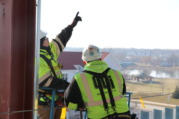 construction workers on lift