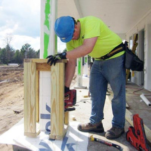 man constructing post