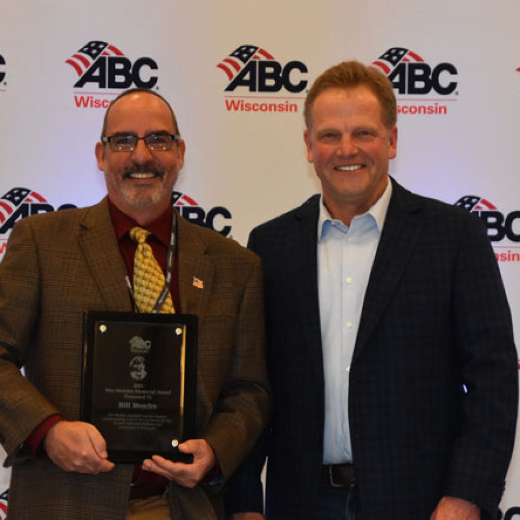 Bill Monfre (left) is presented with the Wes Meilahn Award by 2022 recipient Brian Wieser.