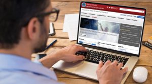 man on laptop with us labor website