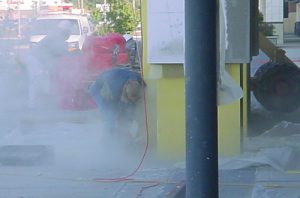 construction worker in dust cloud