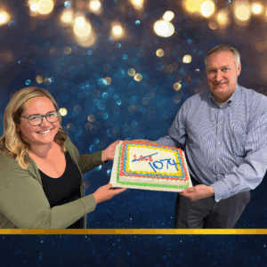 Mary Austinson and Bill Stranberg celebrate membership growth with a cake.