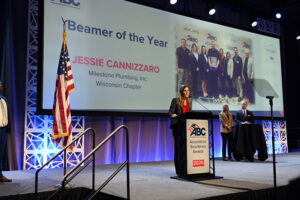 Jessie Cannizzaro speaks to attendees at the ABC National Convention after receiving the "Beamer of the Year" award.